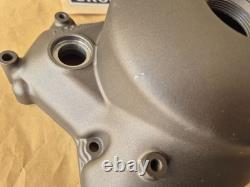 NOS 11341-01A10 TS125X 1986 to 1988 Genuine Suzuki Black Clutch Cover with marks