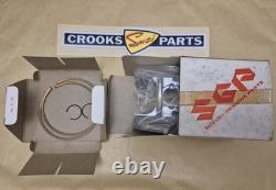 NOS 12110-41791 & 12140-41791 RM370 +. 75mm Genuine Suzuki Piston & Ring Set