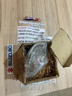 SUZUKI GT125 NOS HEADLIGHT HEAD LAMP LENS STANLEY 6.0789 pt no 35121-36020 NEW
