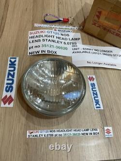 SUZUKI GT125 NOS HEADLIGHT HEAD LAMP LENS STANLEY 6.0789 pt no 35121-36020 NEW