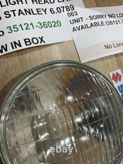 SUZUKI GT125 NOS HEADLIGHT HEAD LAMP LENS STANLEY 6.0789 pt no 35121-36020 NEW