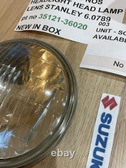 SUZUKI GT125 NOS HEADLIGHT HEAD LAMP LENS STANLEY 6.0789 pt no 35121-36020 NEW