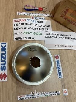 SUZUKI GT125 NOS HEADLIGHT HEAD LAMP LENS STANLEY 6.0789 pt no 35121-36020 NEW