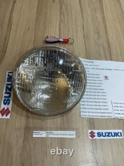 SUZUKI GT125 NOS HEADLIGHT HEAD LAMP LENS STANLEY 6.0789 pt no 35121-36020 NEW