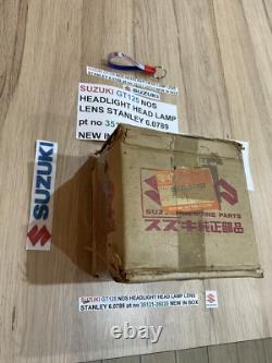 SUZUKI GT125 NOS HEADLIGHT HEAD LAMP LENS STANLEY 6.0789 pt no 35121-36020 NEW