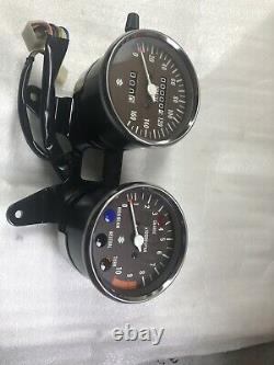 Suzuki GT185 Instrument Assembly Speedometer Tachometer. NOS. 34100-36628