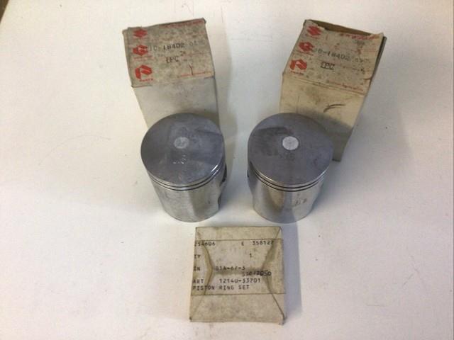 Suzuki Gt250 K, L 1973-1974 +50 Pistons + Rings Genuine Parts Nos 12110-18402-050